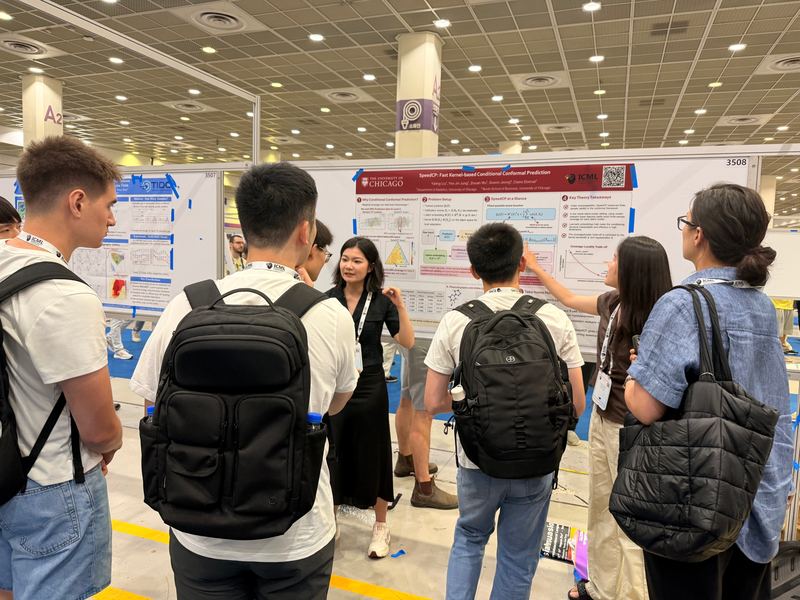 SIGNAL Lab students discussing the SpeedCP poster with attendees at ICML 2026